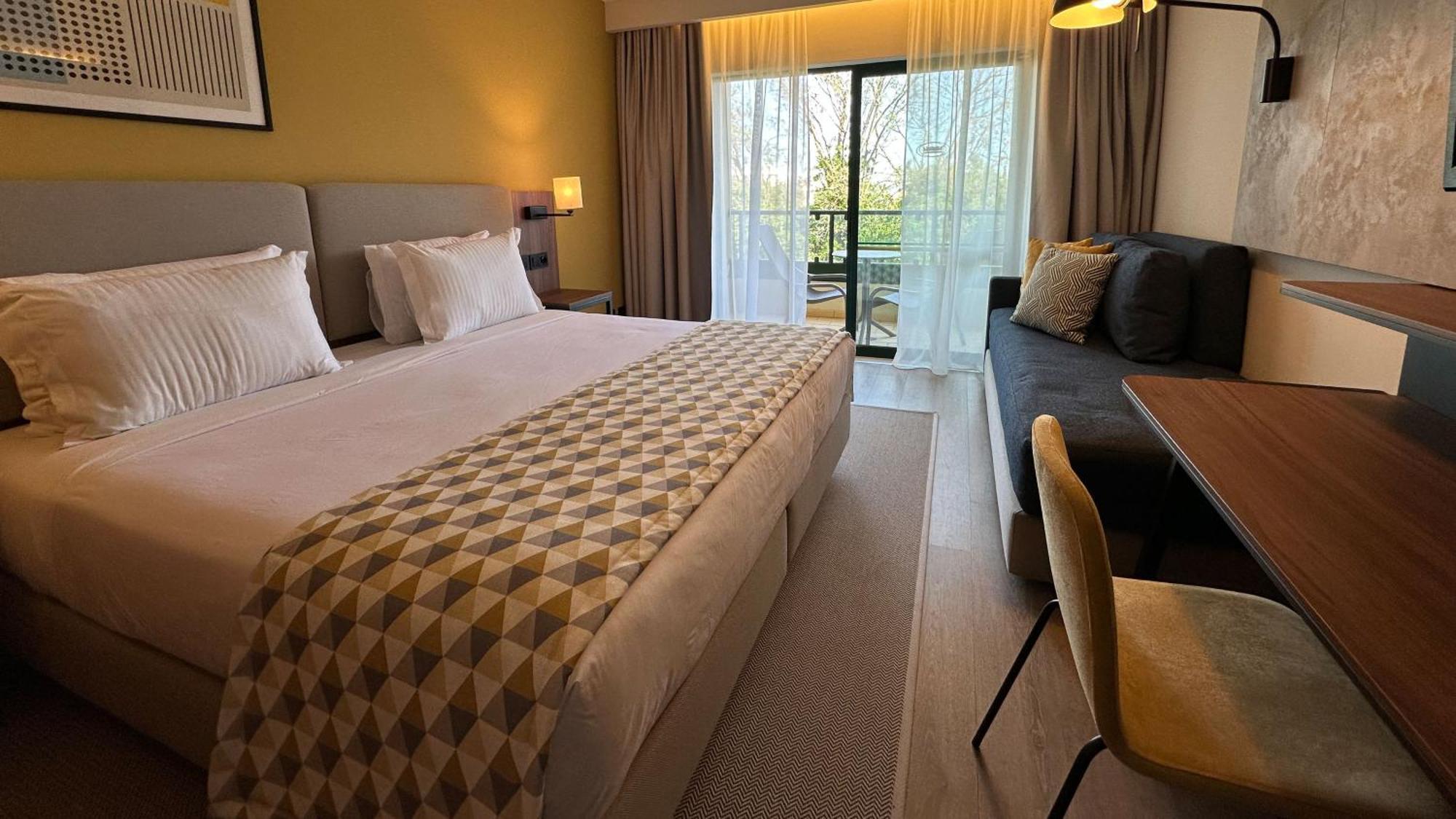 Standard Twin Room with Furnished Balcony and Single Sofa Bed